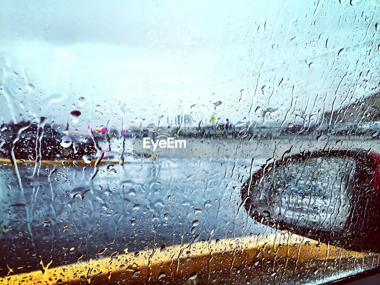 Full frame shot of wet window on car