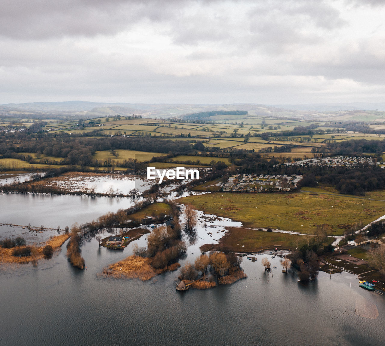 High angle view of river amidst landscape against sky