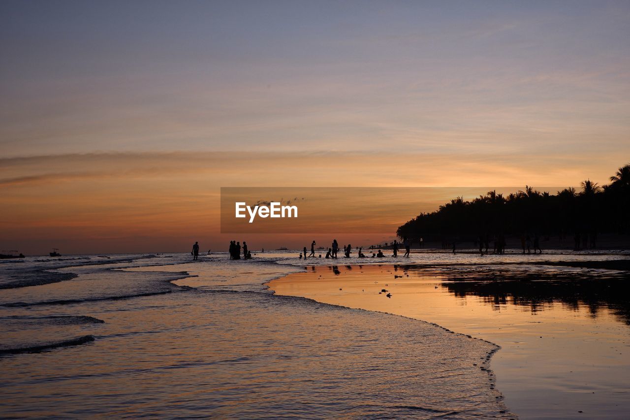 Sunset reflects in the beautiful and calm sea. 