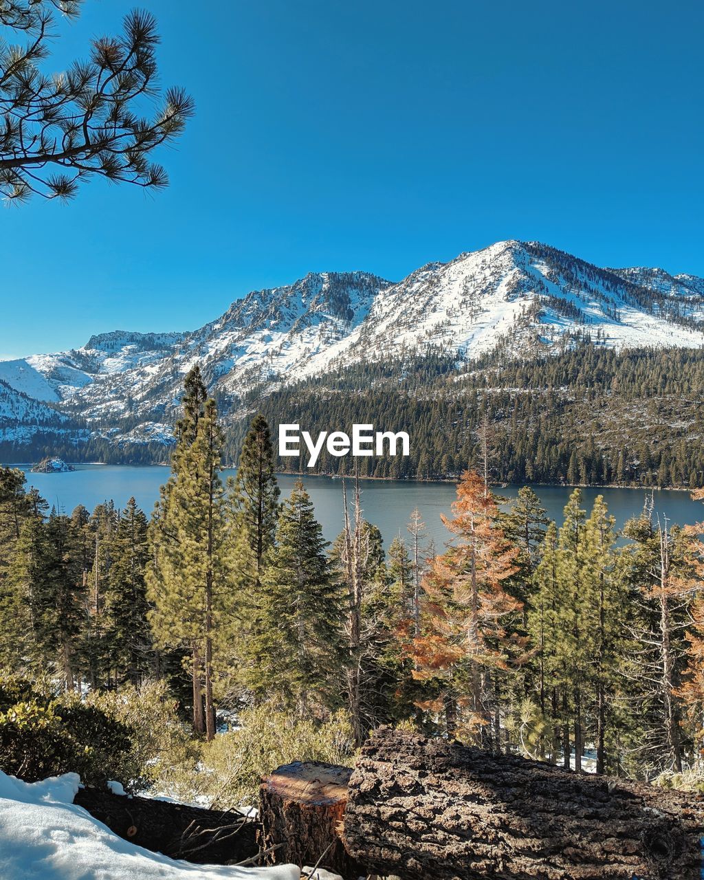 Scenic view of snowcapped mountains against blue sky