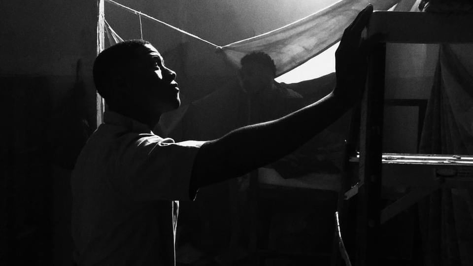 black, black and white, one person, darkness, monochrome, monochrome photography, adult, men, white, indoors, waist up, silhouette, music, arts culture and entertainment, lifestyles, person, light, pianist