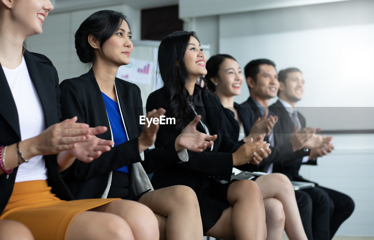 Business people applauding during presentation