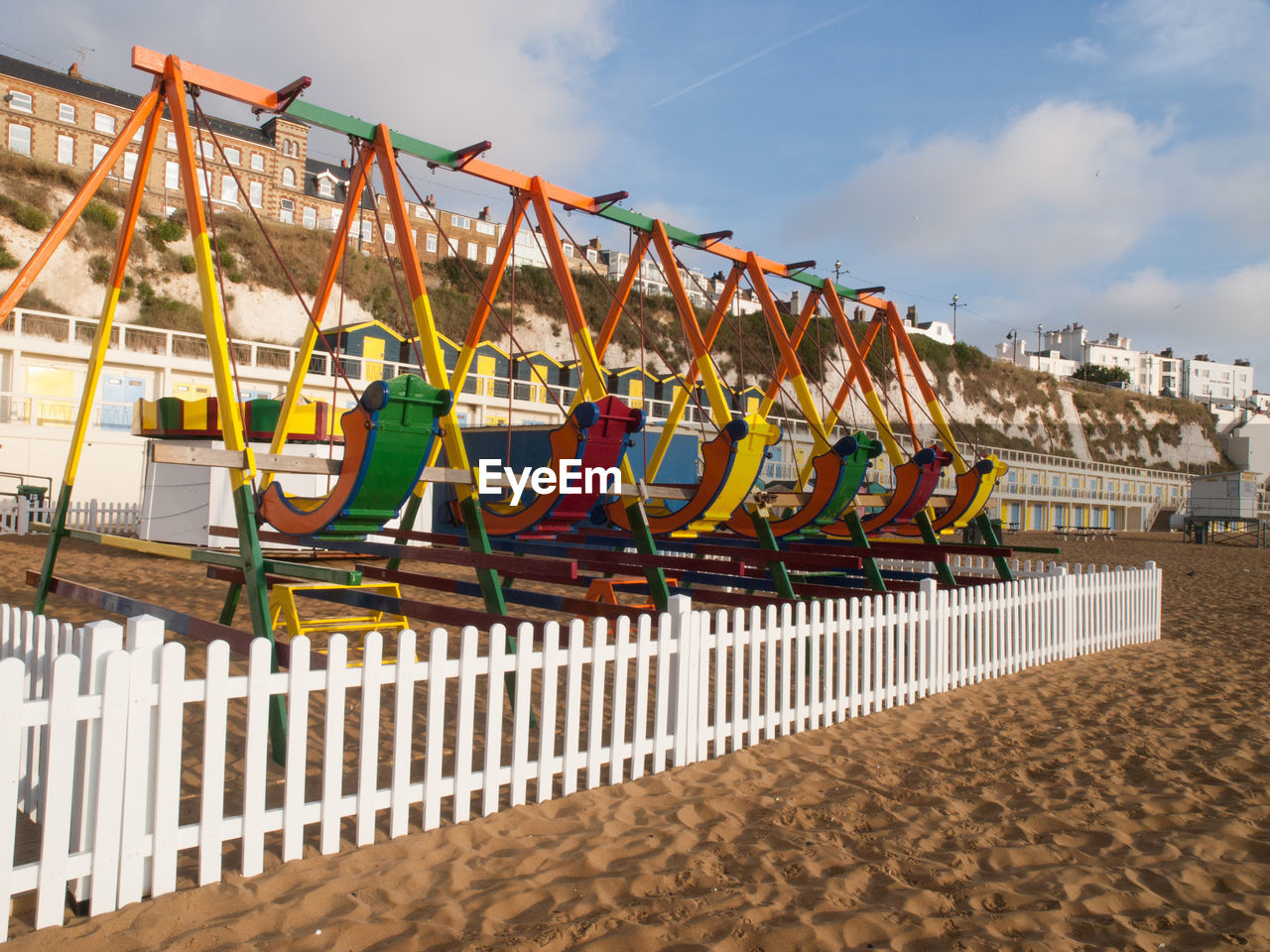 ROW OF UMBRELLAS ON BEACH