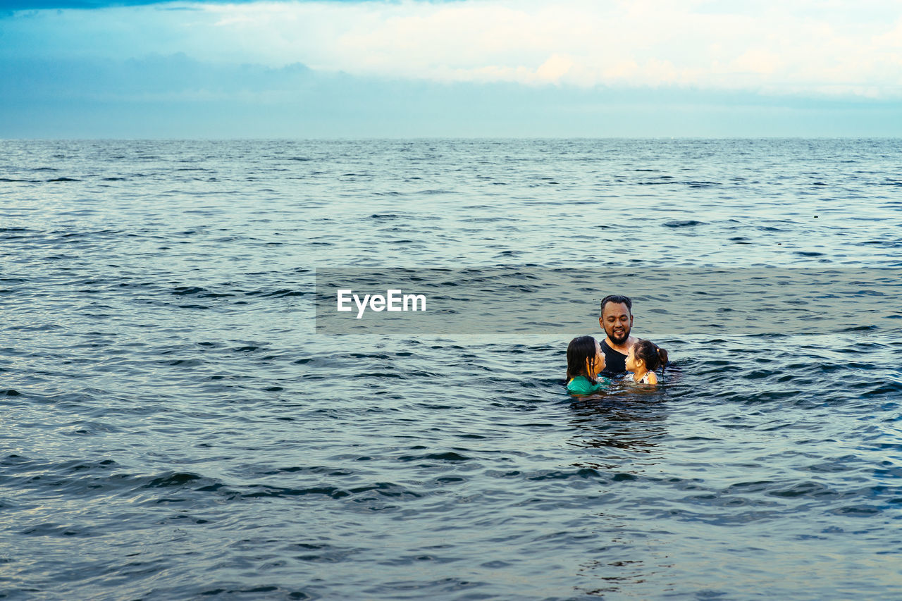 Bearded man swimming in the sea.