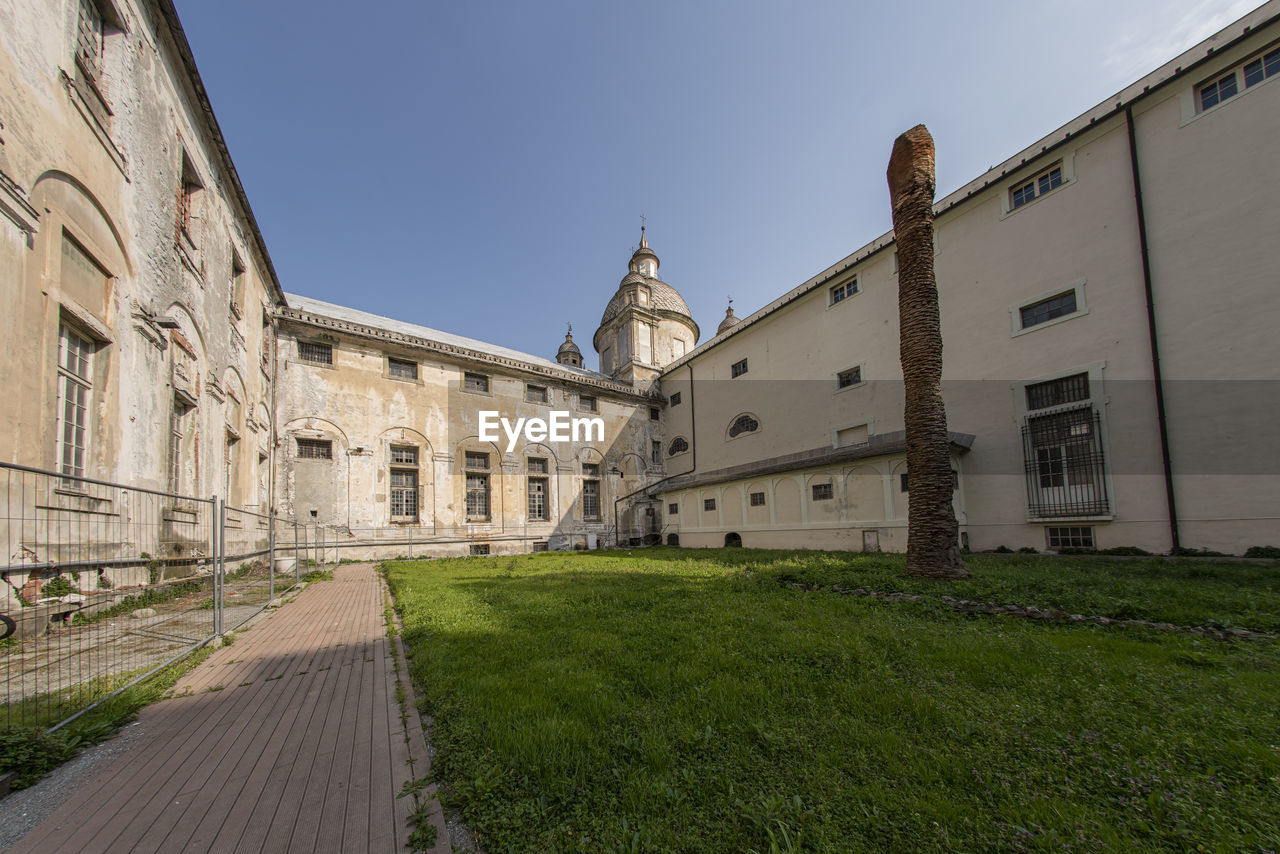 architecture, building exterior, built structure, building, sky, history, grass, the past, estate, nature, travel destinations, château, city, travel, tourism, plant, place of worship, no people, religion, clear sky, outdoors, old, street, day, town, belief, waterway, blue