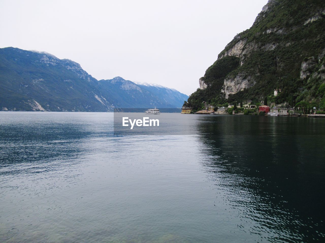 Scenic view of mountains and river against sky
