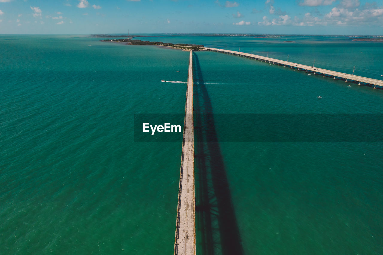 high angle view of bridge over sea against sky