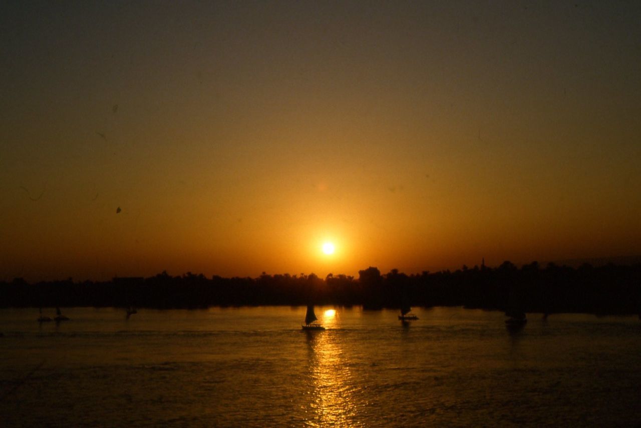 SCENIC VIEW OF SUNSET OVER SEA