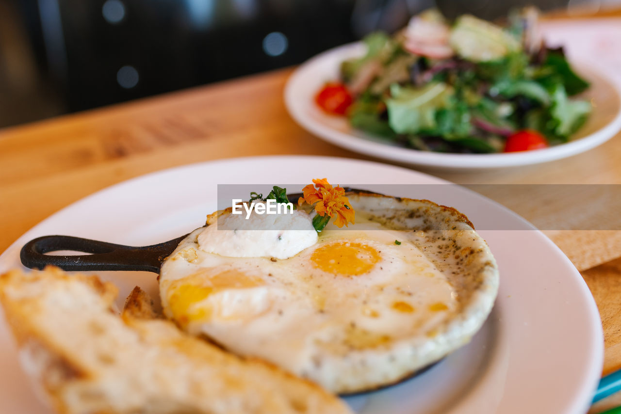 American tomorrow at the cafe. fried eggs in a frying pan