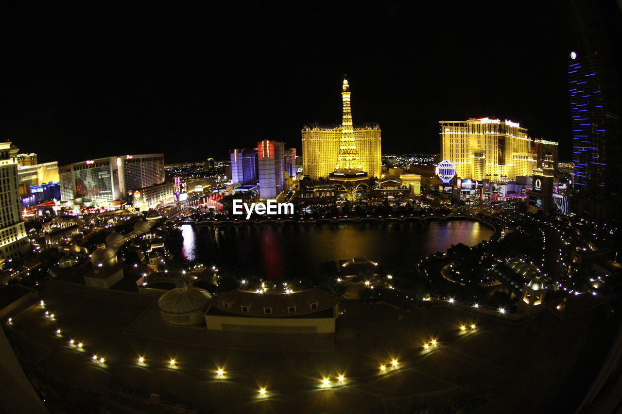 ILLUMINATED CITYSCAPE AT NIGHT