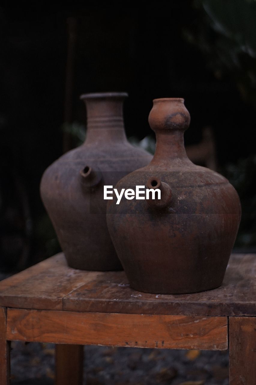 Close-up of old pot on table