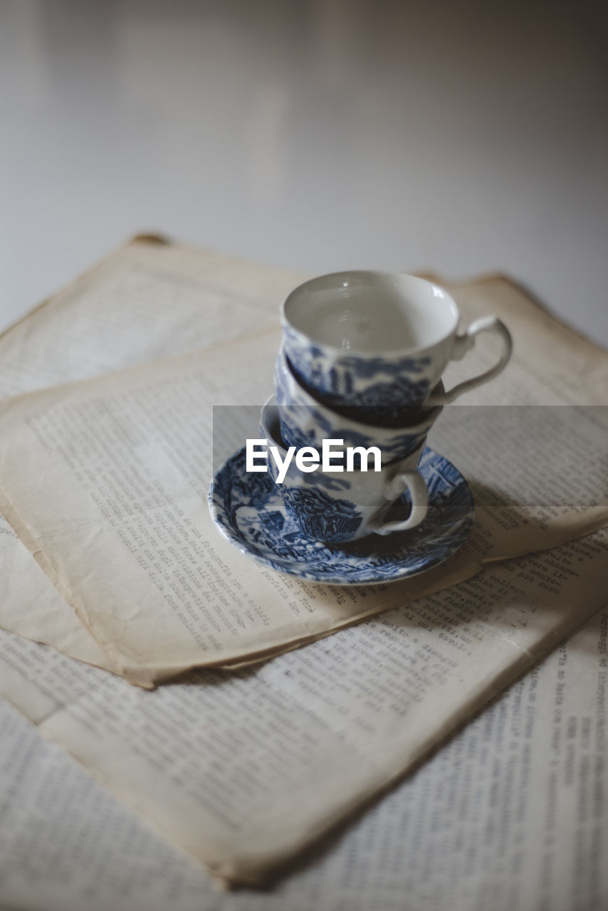 Close-up of tea cups on table