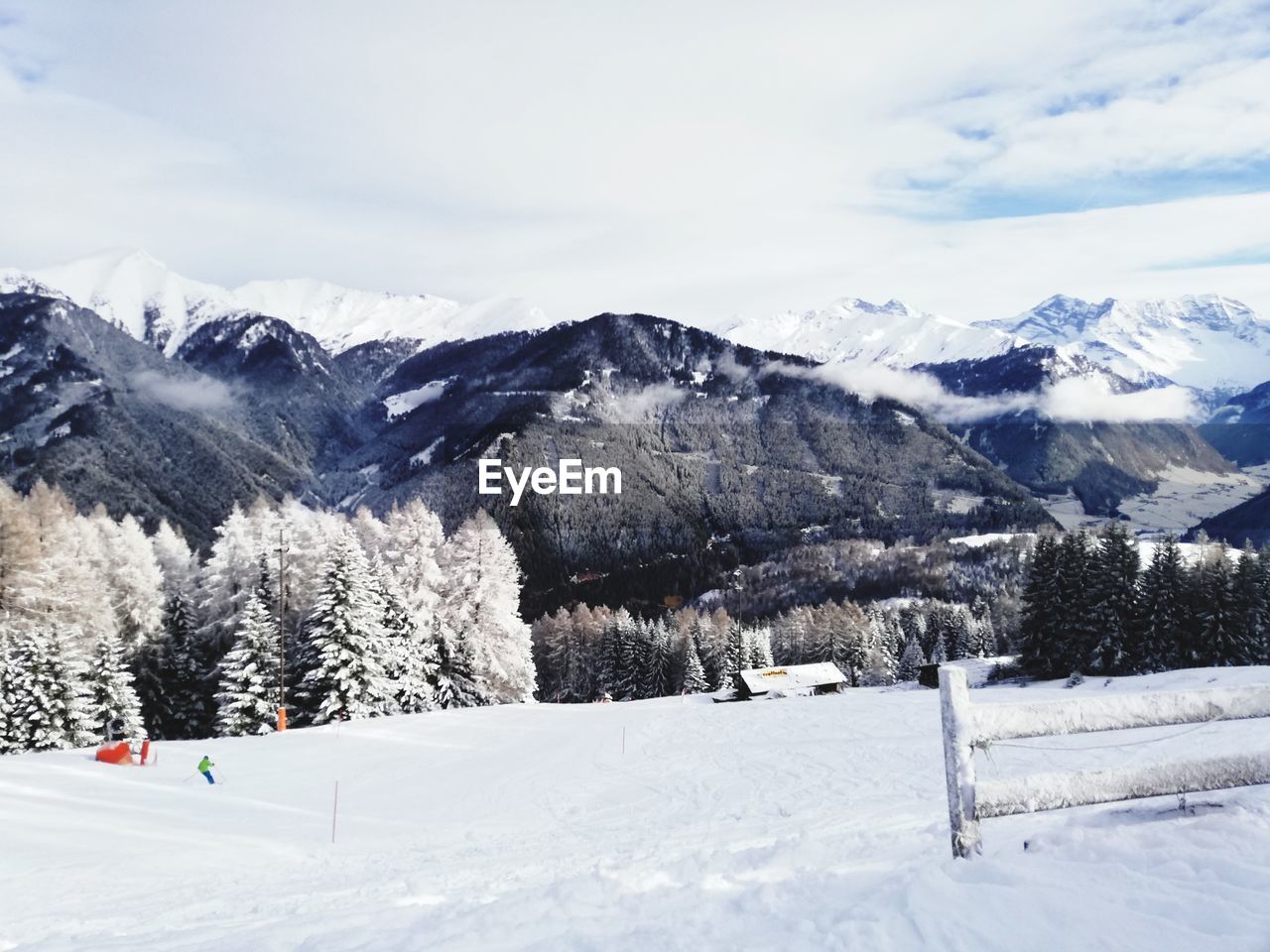 SNOW COVERED MOUNTAIN AGAINST SKY