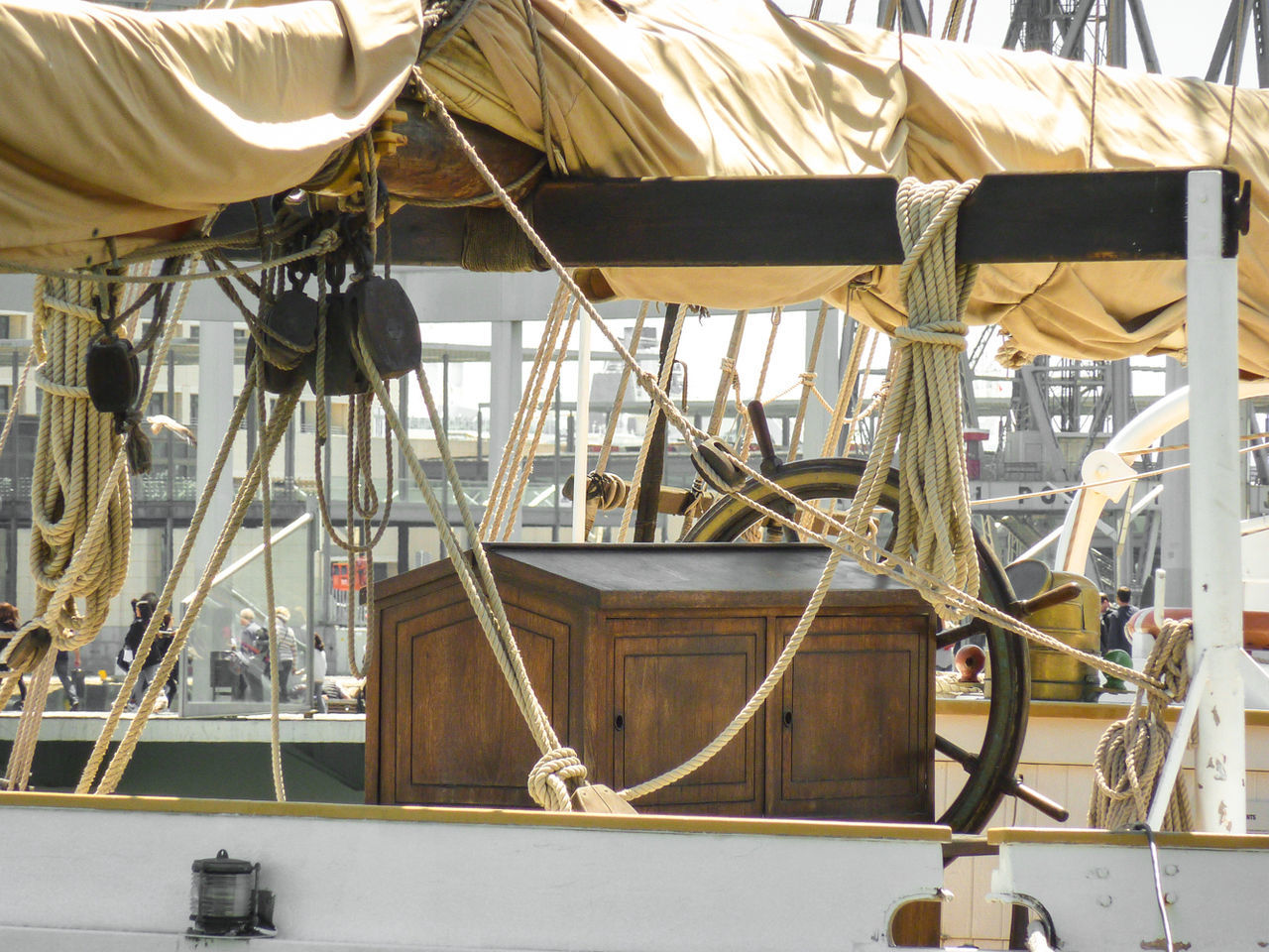 Wheel and ropes at sailing ship