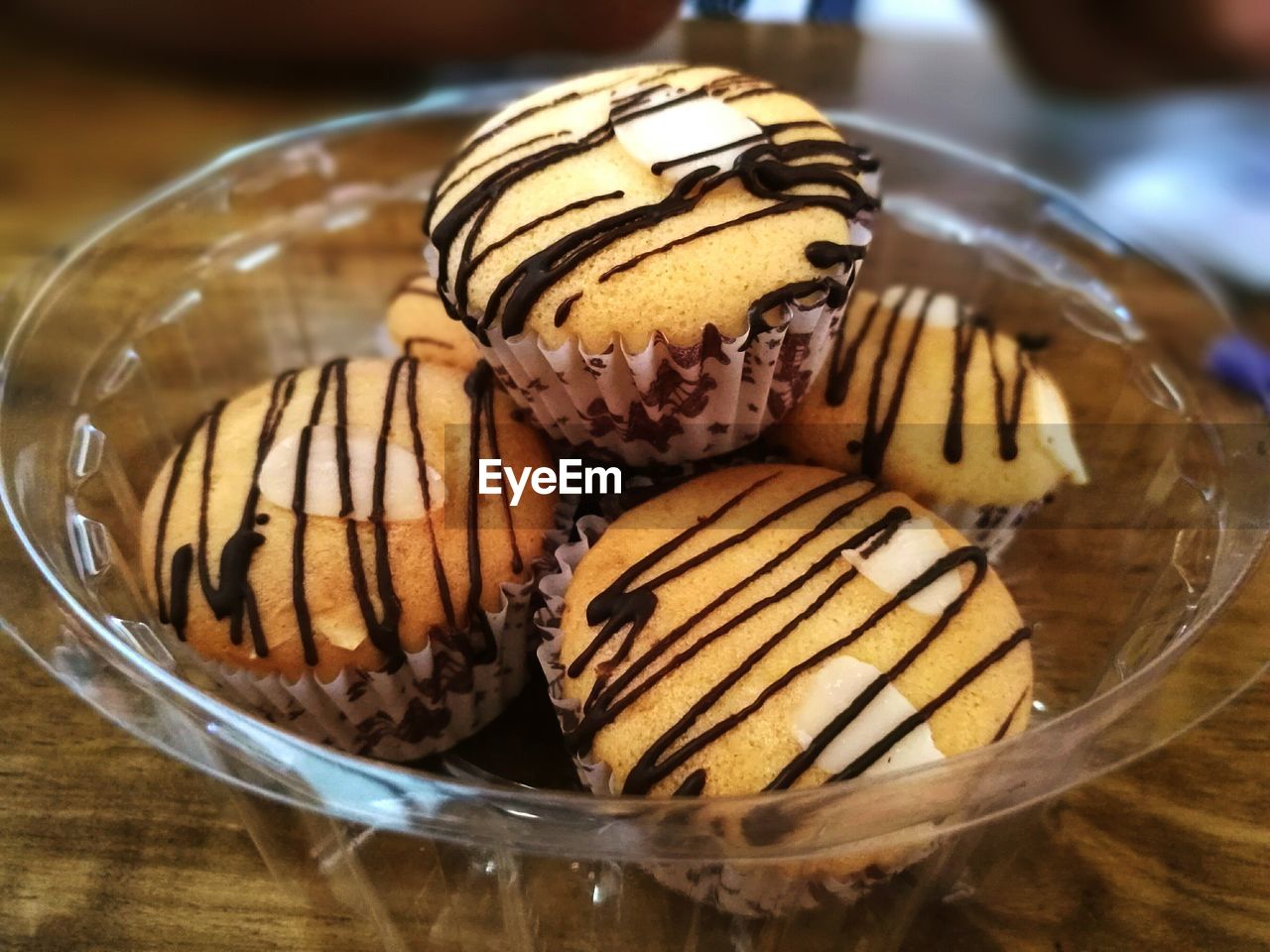 Chocolate sauce drizzled on muffins