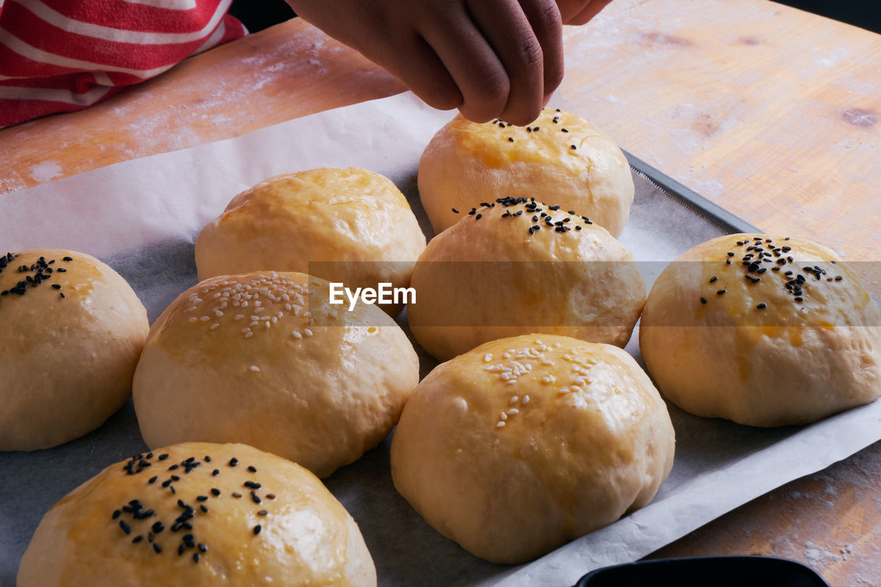 Close-up of person preparing food in kitchen