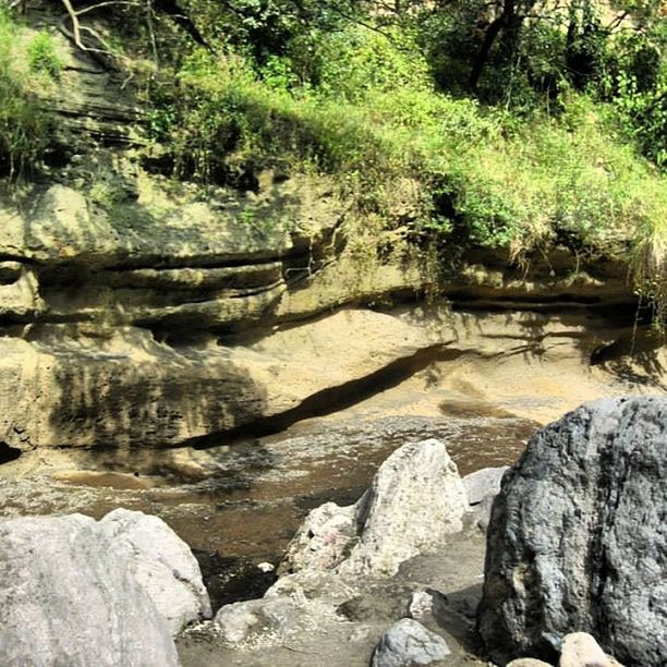 STREAM FLOWING THROUGH ROCKS