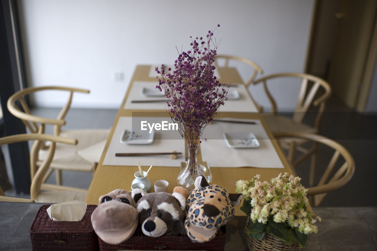 CLOSE-UP OF POTTED PLANTS ON TABLE