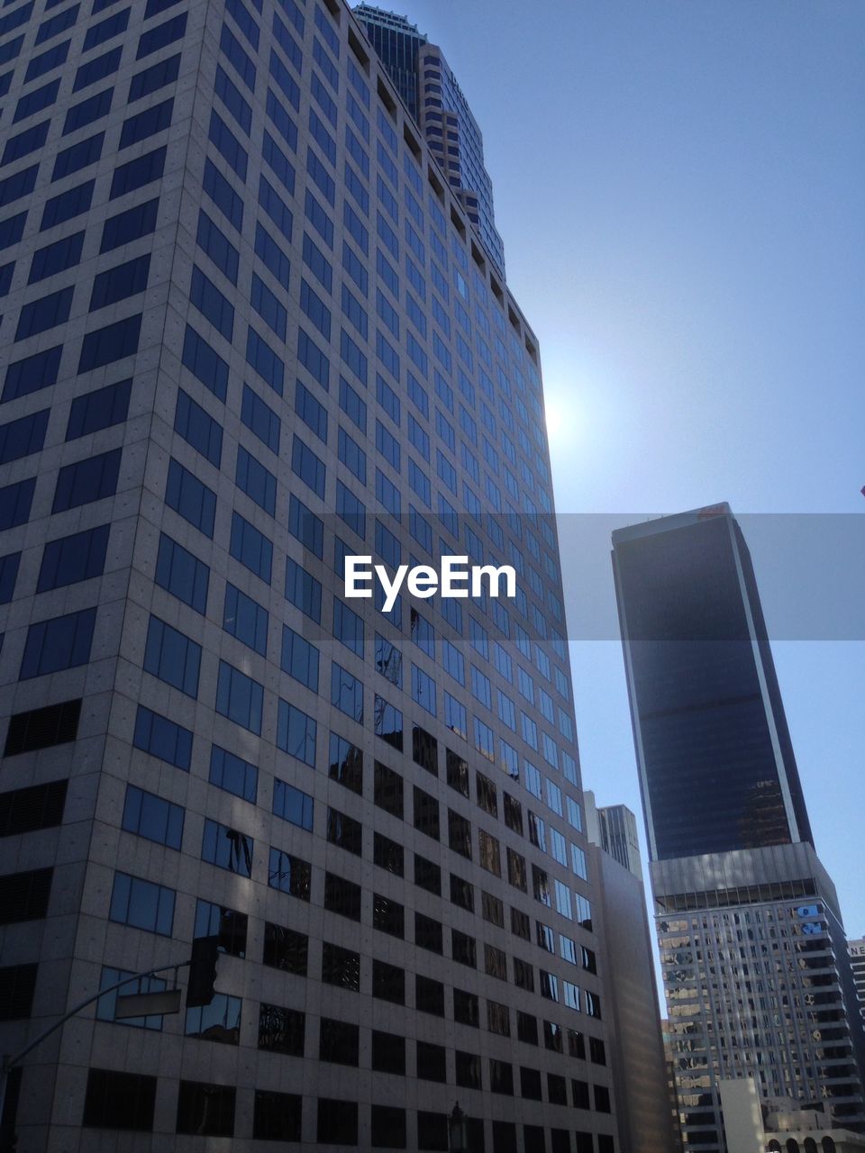 LOW ANGLE VIEW OF MODERN BUILDINGS AGAINST SKY