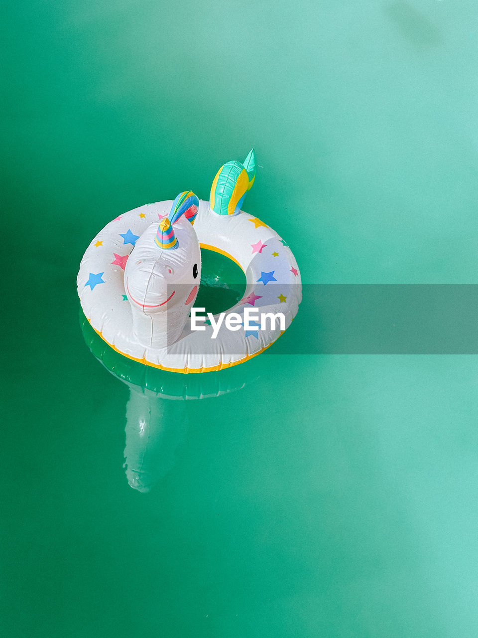 High angle view of water toy on blue swimming pool 
