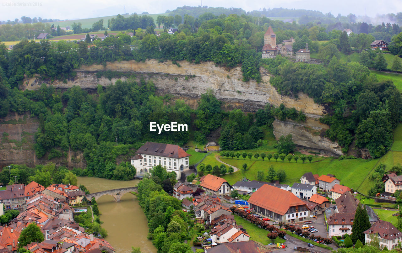 High angle view of built structures against trees