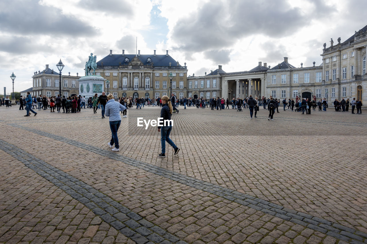 Group of people in front of historical building