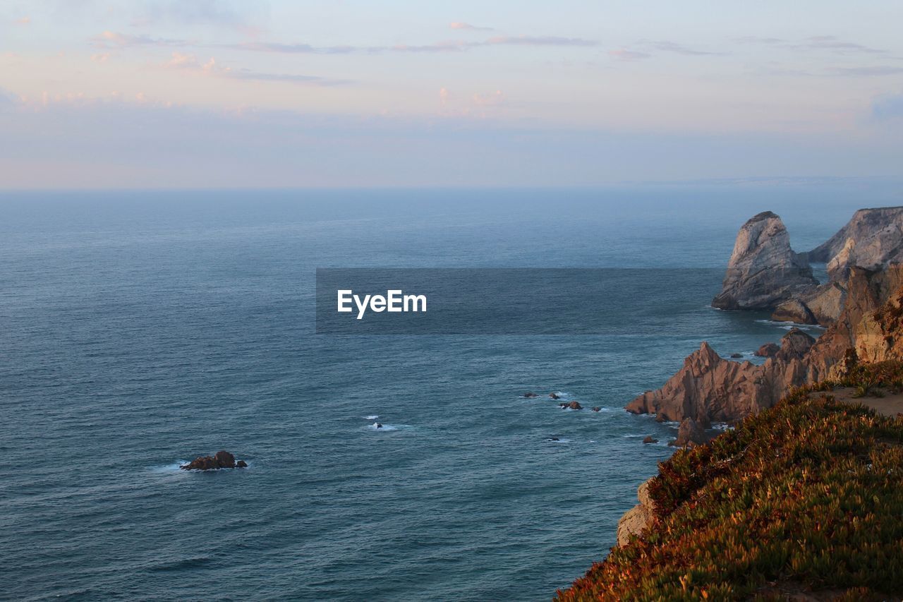 Scenic view of sea at sunset