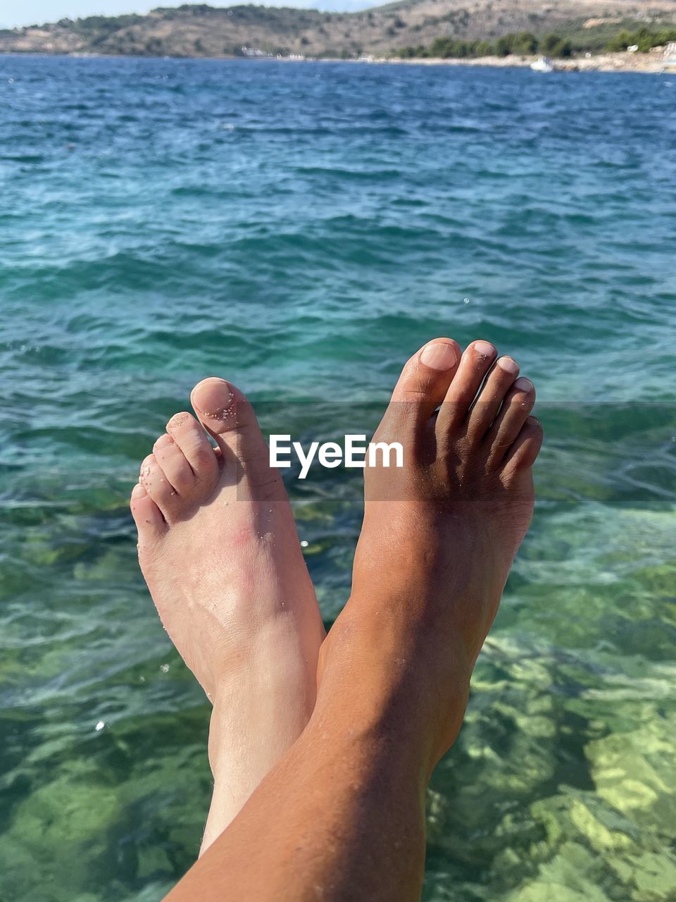 water, nature, one person, barefoot, human leg, low section, day, swimming, leisure activity, sea, lifestyles, human foot, limb, hand, outdoors, adult, human limb, relaxation, trip, holiday, motion, men, vacation, close-up