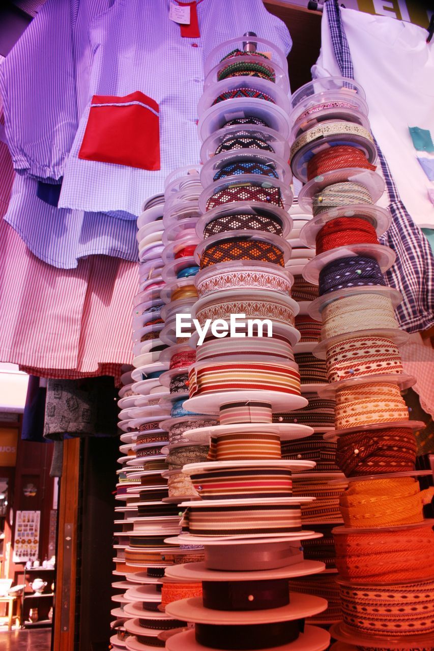 Stacks of lace spools at market stall