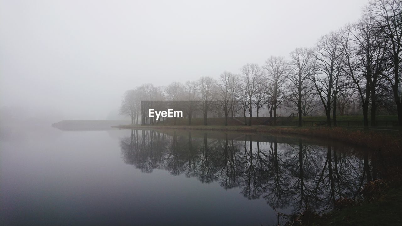 SCENIC VIEW OF LAKE IN FOGGY WEATHER