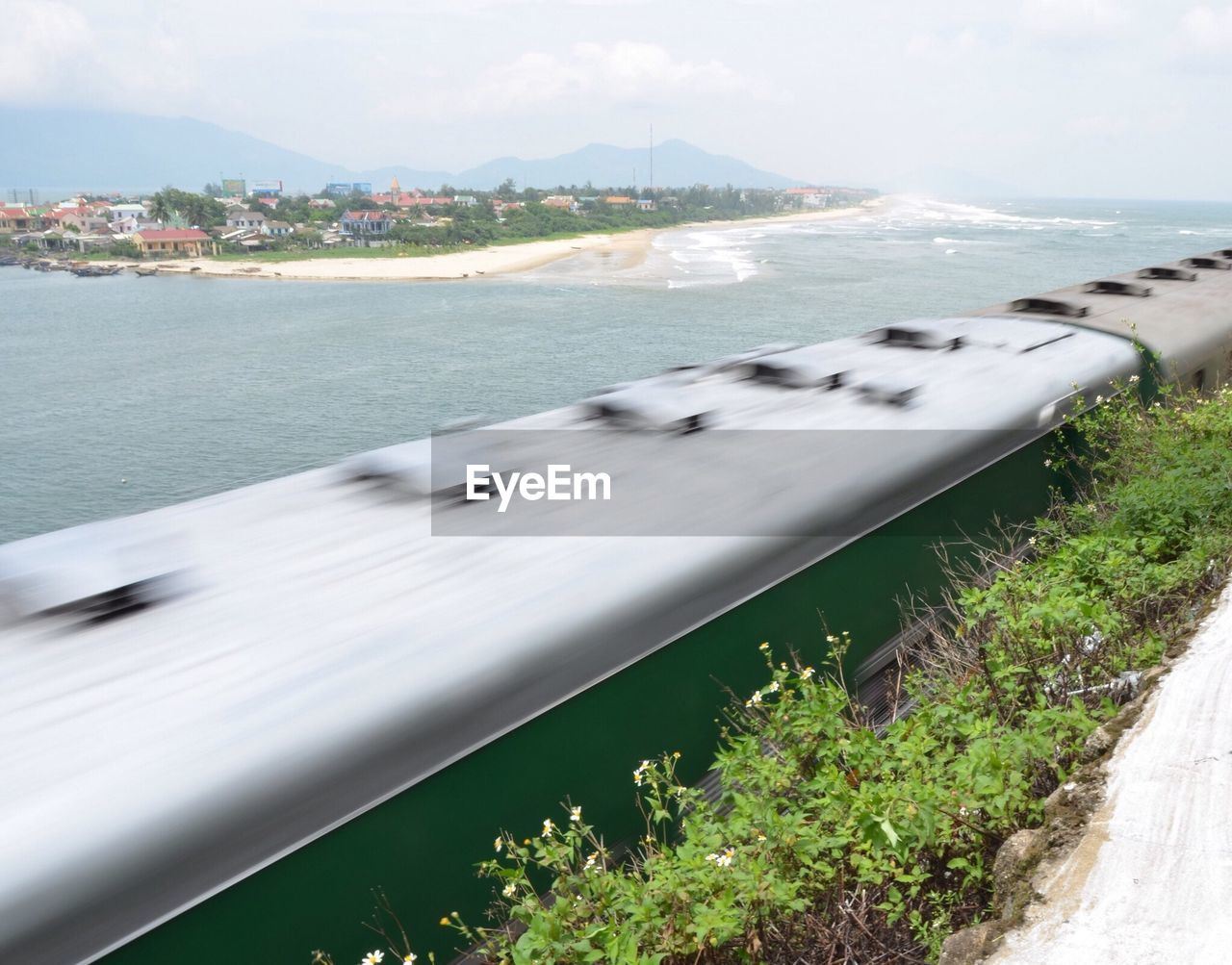 Blurred motion of train passing over sea