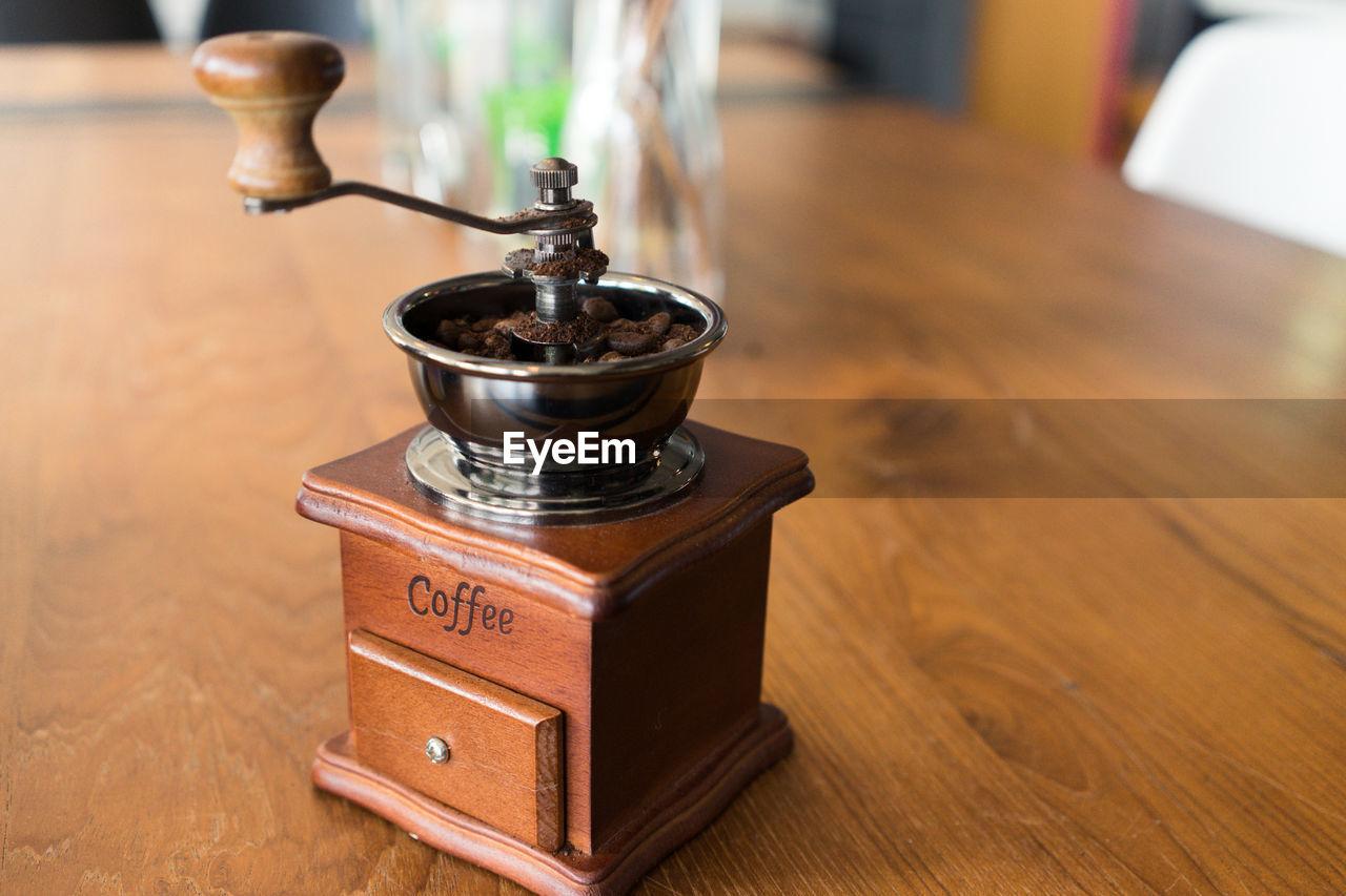 Close-up of coffee maker on table