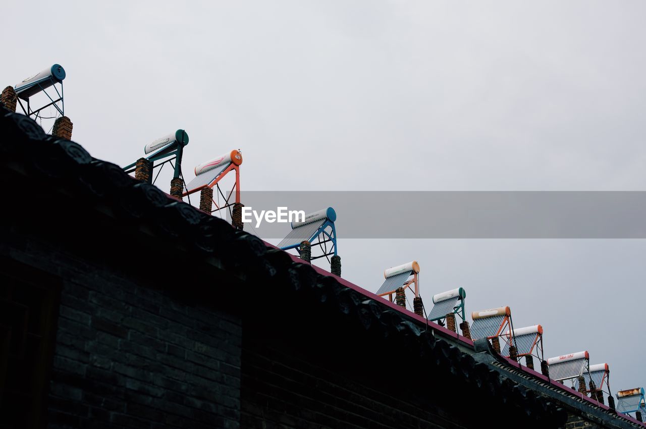 LOW ANGLE VIEW OF CONSTRUCTION SITE AGAINST SKY