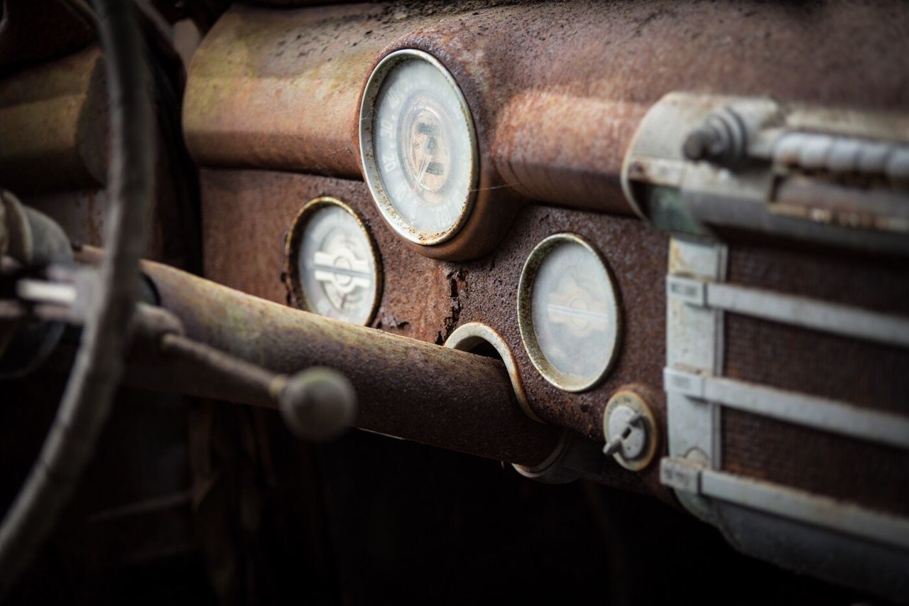Close-up of abandoned car dashboard