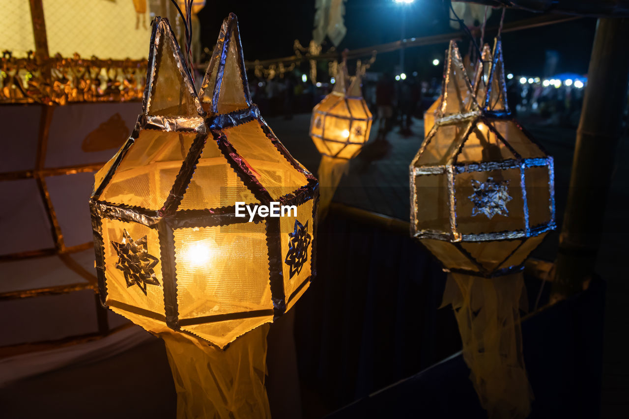 Close-up of illuminated lanterns at night