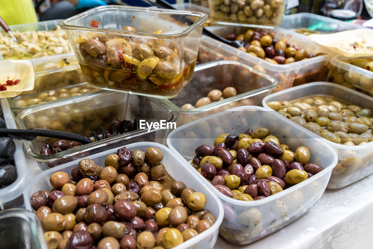 Assortment of olives being sold at a traditional farmers street market