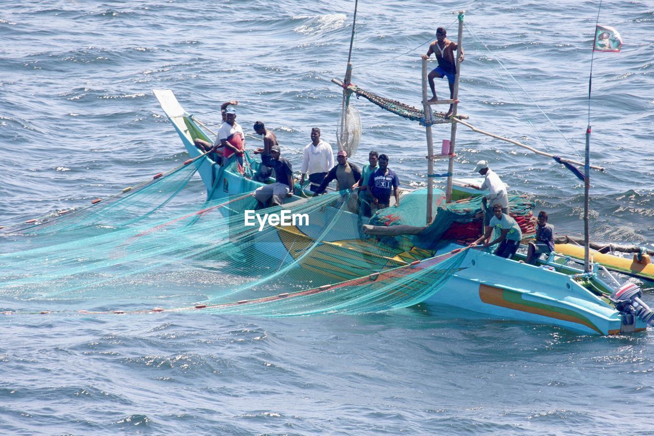 PEOPLE SAILING IN SEA