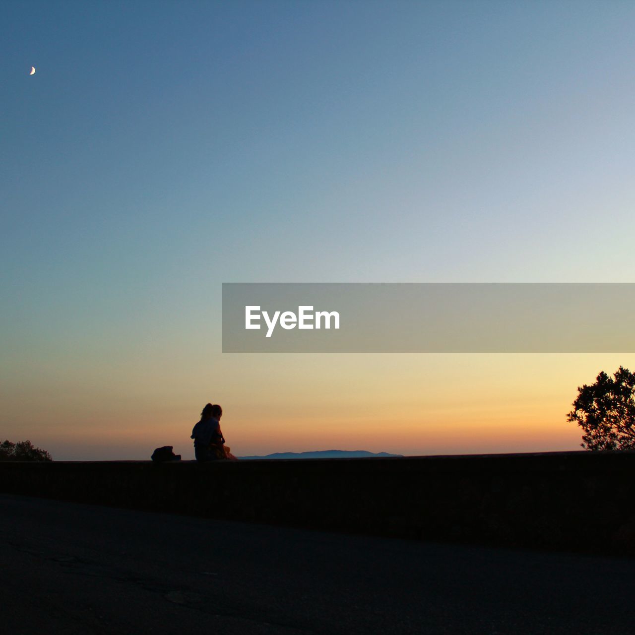 SILHOUETTE MAN ON LANDSCAPE AGAINST CLEAR SKY DURING SUNSET