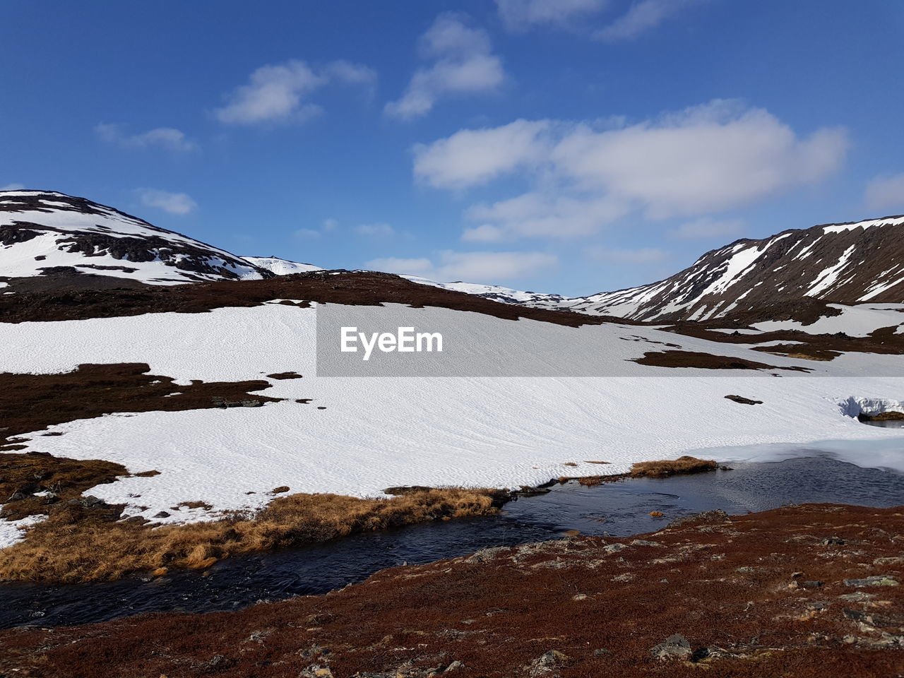 SNOW COVERED MOUNTAIN AGAINST SKY