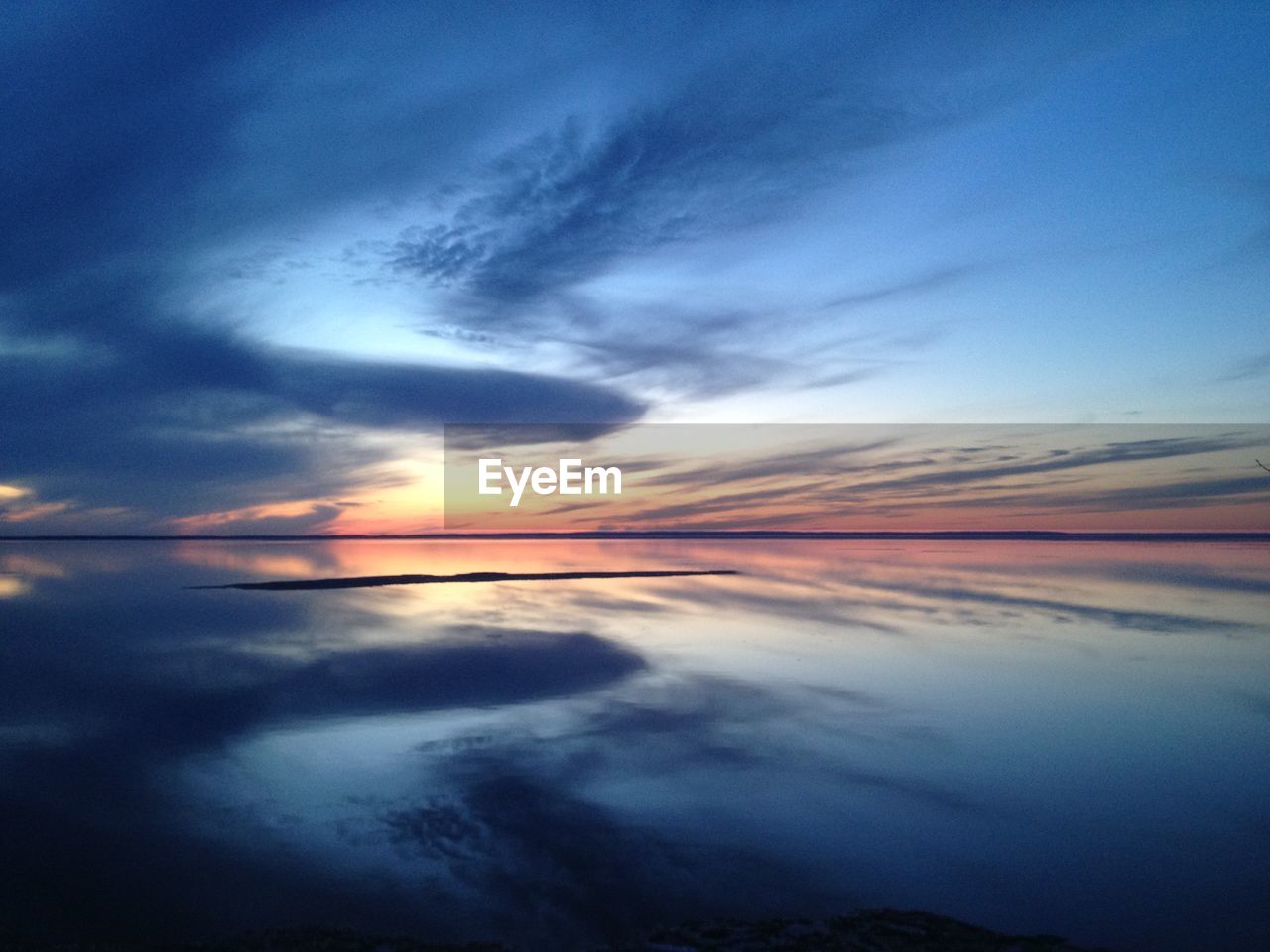 Scenic view of sea against sky at sunset