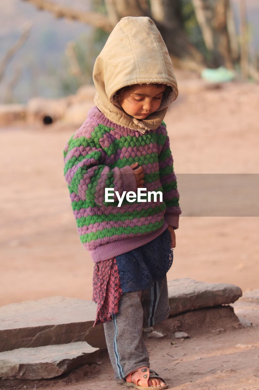 Child standing outdoors