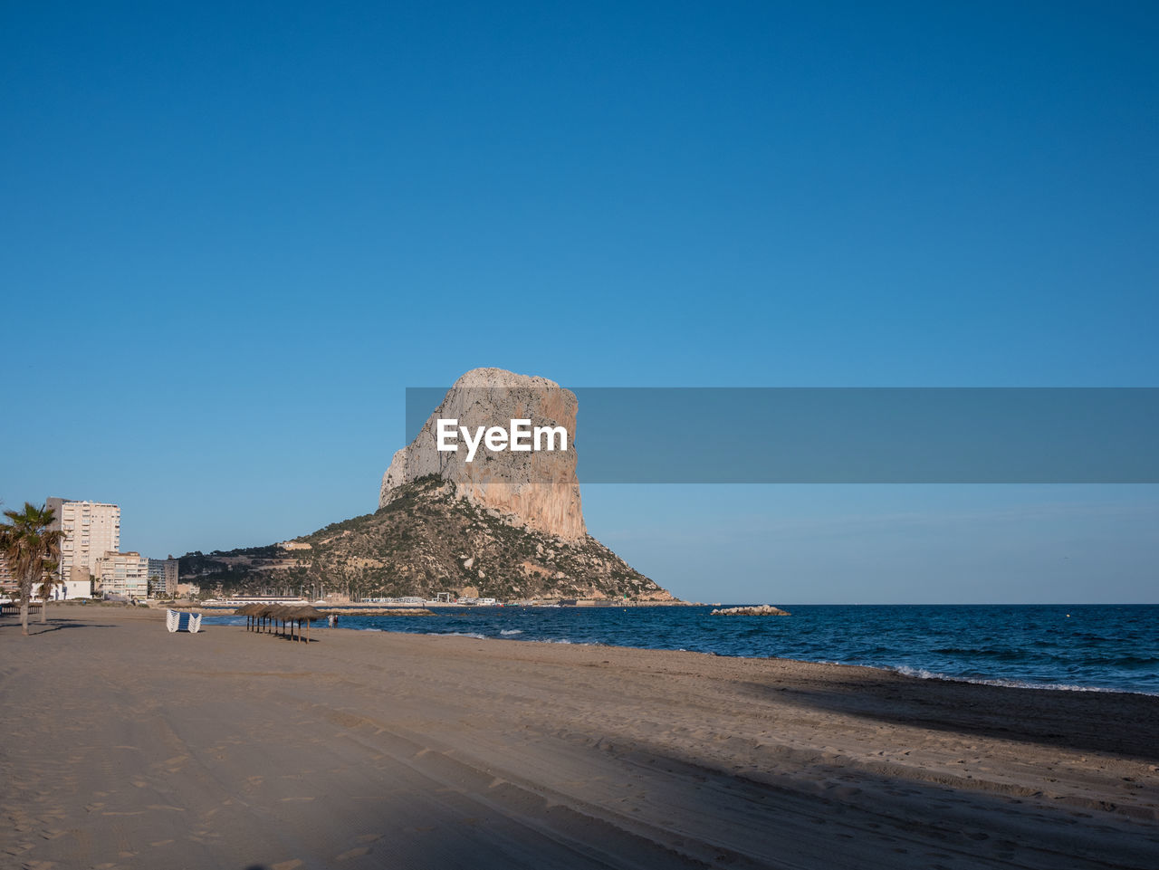 Scenic view of sea against clear blue sky