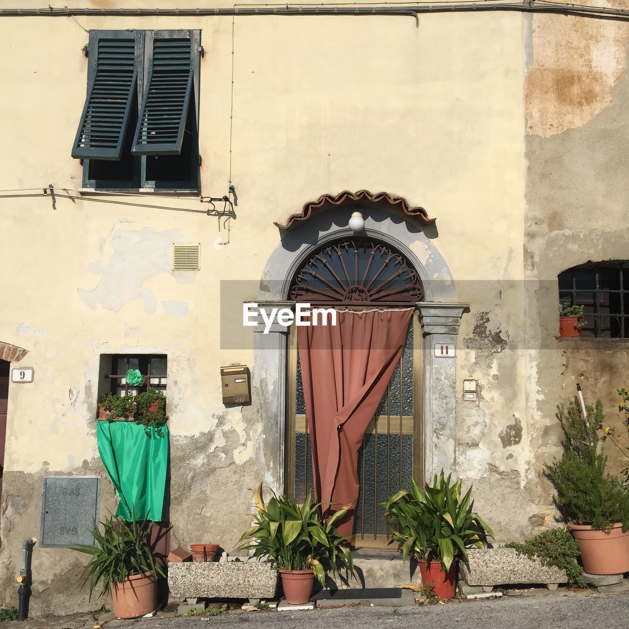 Low angle view of door and window on building