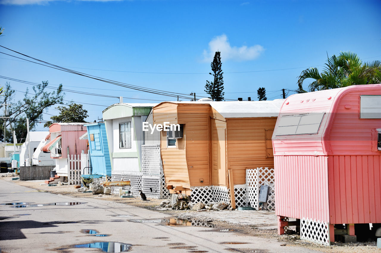 tiny and colorful trailer neighborhood in Key West Florida Building Exterior Architecture Built Structure Sunlight No People Day Building Trailerpark Colors Bright Bright Colors Neighborhood Florida Life Trailer Trailer Park Colorful Houses Key West Key West Living Tiny Planet Exploring Neighbors Affordable Housing Color