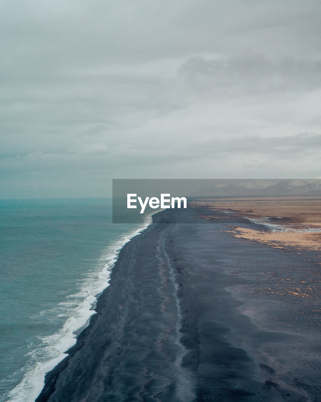 Scenic view of sea and beach against sky