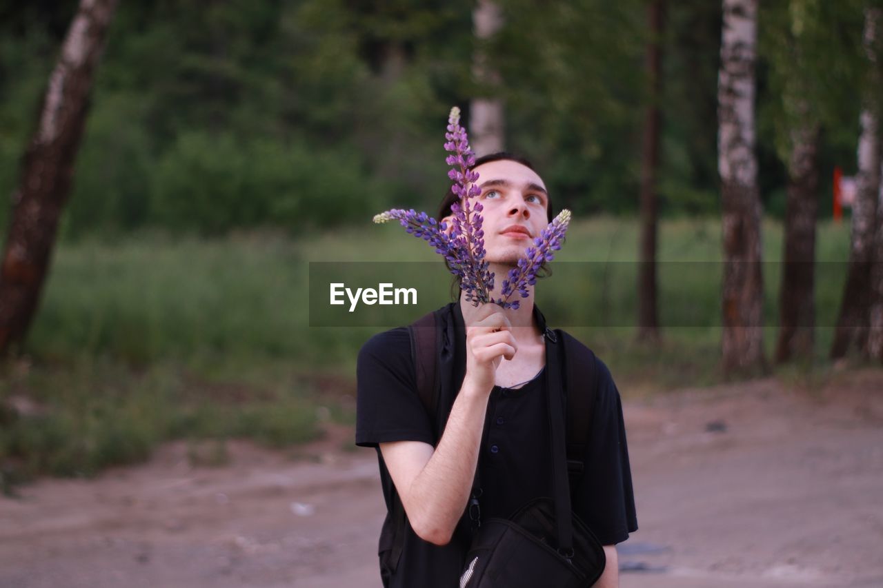 Man holding flowers