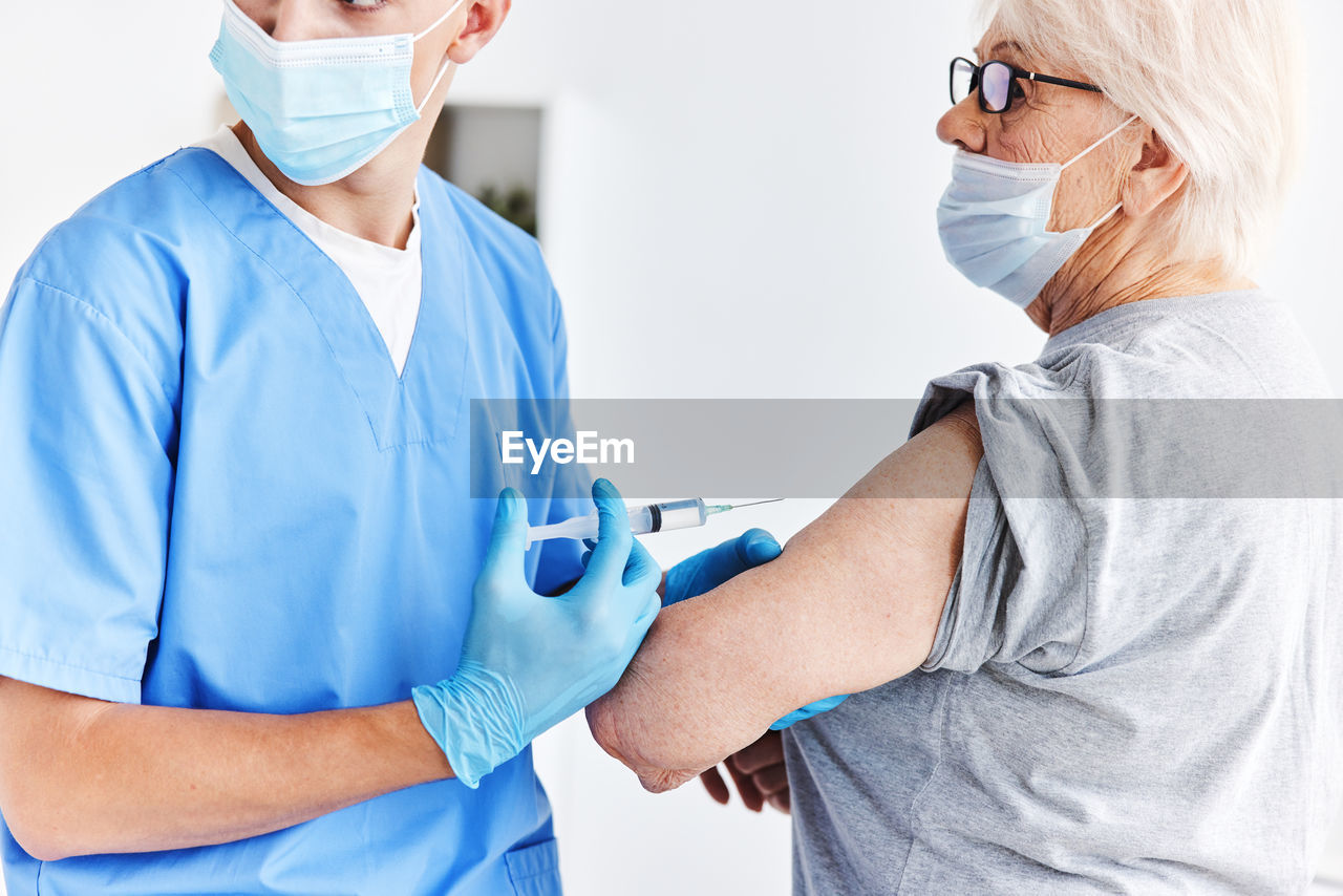 Female doctor giving medicine