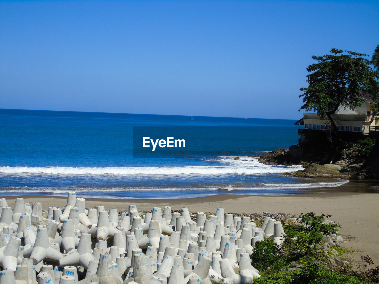 Scenic view of sea against clear blue sky