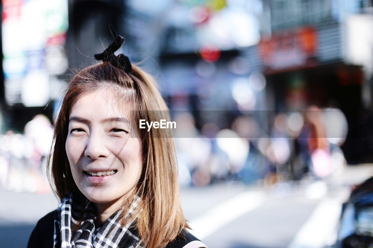 Portrait of smiling woman on street