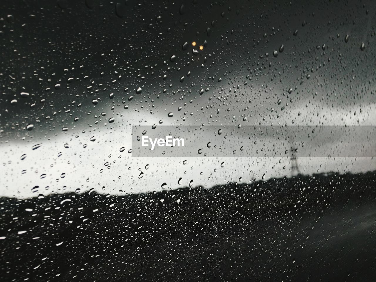 Full frame shot of wet car window during rainy season